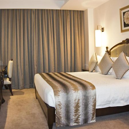 Tang Palace Hotel أكرا الغرفة الصورة